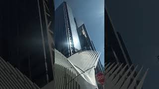 View of street gardens blue sky skyscrapers and walkers [upl. by Heymann743]