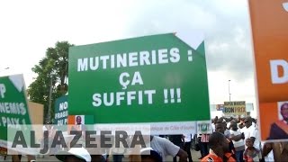 Ivory Coast mutiny Soldiers continue standoff over pay [upl. by Bunch668]