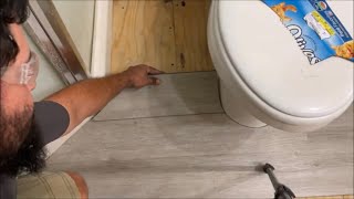 how to cut laminate vinyl FLOORING around toilet doors bath cabinets ANYTHING easy DIY [upl. by Atiekram]