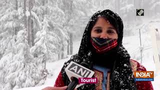 Tourists enjoy snowfall in JampKs Patnitop [upl. by Ahsyak]