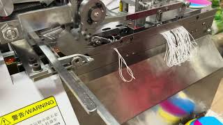 Automatic Hang Tag Cloth Tag Elastic String Cord Knot Tying String Threading Knotting Machine [upl. by Ilujna]