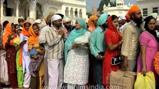 Devotees gathered to pay their respects at the Golden temple in Amritsar [upl. by Hakeber]