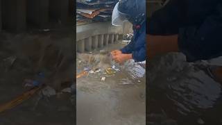 Clean up trash clogged culvert drain under raindrops shorts cleaning satisfying plastic [upl. by Ekal]