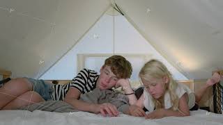 Children relaxing inside camping tent [upl. by Lemkul]