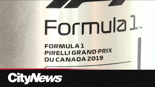 Quebecer behind some F1 Grand Prix trophies [upl. by Grane]