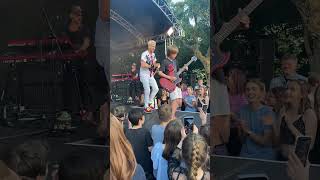 Cant believe this happened 🤯 10 year old asks band at festival to let him play guitar [upl. by Waldron]