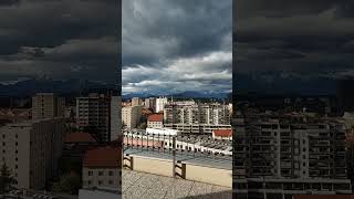 Panoramic view of Ljubljana and Alps from city centre rooftop [upl. by Sollie]