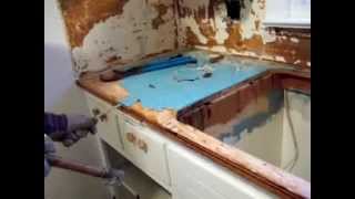 Removing formica blue wood glued on counter tops demolition remodel [upl. by Omero]