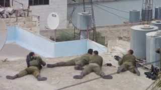 Israeli soldiers celebrate shooting a Palestinian youth [upl. by Prudie471]