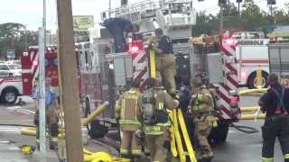 Firemen Putting Hose On Fire Truck [upl. by Enaillil]