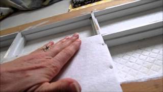 Putting fabric on the painted window frame [upl. by Ecirtel]