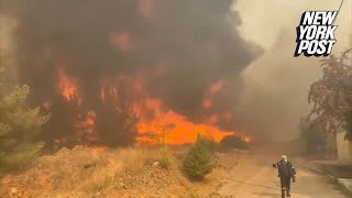 Harrowing videos show massive wildfire in Greece as residents evacuate [upl. by Mullins]