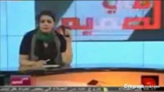 Libya conflict TV presenter waves gun and threatens to become martyr [upl. by Ulland]