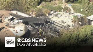 Firefighters extinguish flames burning Reseda home amid sweltering hot temperatures [upl. by Lombardi611]