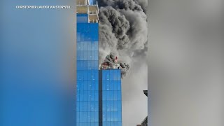 Crane operator rescues man from burning highrise in England video shows [upl. by Neslund]