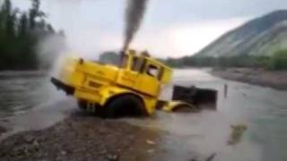 A Russian tractor driver refuses to give up after his vehicle gets stuck in a river [upl. by Ihcekn242]