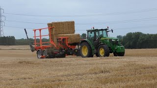 John Deere 6R155 Chasing Bales with Big Bale Transtacker [upl. by Eanel826]