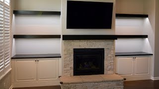 Custom built in cabinets floating shelves and fireplace mantel [upl. by Hildagard]