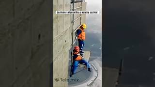 Scaffolders dismantling a hanging scaffold [upl. by Waverly]