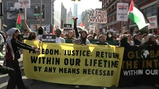 Protesters take to the streets for Flood NYC for Palestine rally  AFP [upl. by Adiam860]