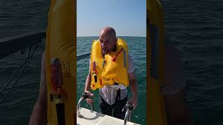 How do life jackets work when you fall overboard lifesavers lifehack boatlife [upl. by Einnek]