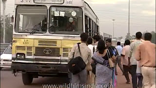 Delhi DTC diesel bus service circa 19982004  commuters board moving Blueline and Redline buses [upl. by Ponce302]