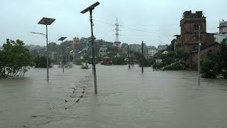 Torrential rain triggers deadly flooding in Nepal  AFP [upl. by Anida]