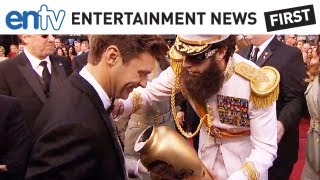 SACHA BARON COHEN ASHES SEACREST Oscars prank dumps Kim Jong ILs Ashes on Ryan Seacrest ENTV [upl. by Hacissej640]