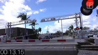 Video Brightline vs Freight Train times to amp thru a crossing [upl. by Mikkanen621]