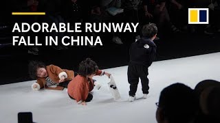 Adorable runway fall at kids fashion show in China warms hearts [upl. by Aihsyak]