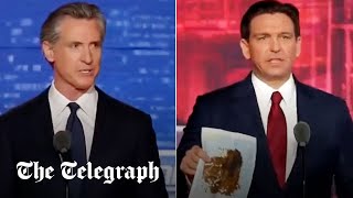 Ron DeSantis holds up human faeces map in a bizarre stunt during a televised debate [upl. by Ellednek985]