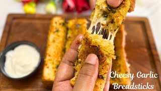 Cheesy Garlic Breadsticks Recipe  GARLIC BREAD  Foodies Corner [upl. by Htabazile]