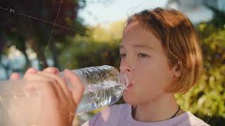 Teen drinking water on city street [upl. by Dare]