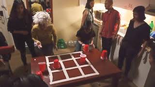 Christmas Party Game  Flip Cup Tic Tac Toe Part 1 [upl. by Oimetra]