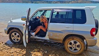 car stuck girl in the mud  pedal pumping car cranking offroad pajero io [upl. by Darelle687]